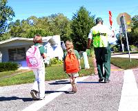 Crossing Guard Crossing the Street